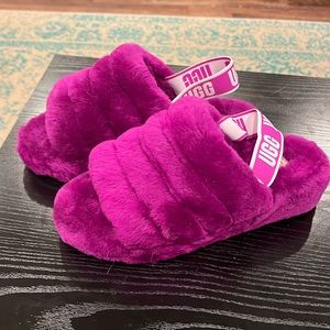 Women’s UGG fluff, yeah slippers, size 10 in a vibrant purple, Brand New no box.
